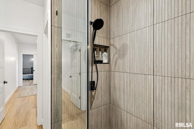 18101 271st St, Long Grove, IA 52756 - detailed view of a tile shower, wood finished floors, and baseboards