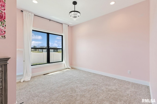 18101 271st St, Long Grove, IA 52756 - spare room with carpet floors, recessed lighting, baseboards, and a chandelier