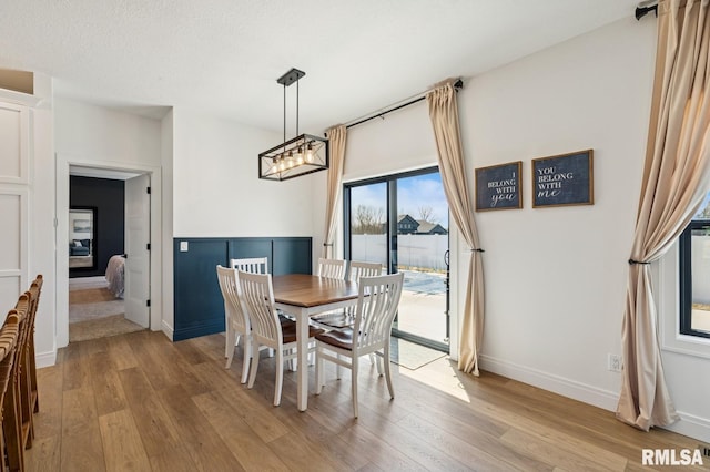 18101 271st St, Long Grove, IA 52756 - dining area featuring light wood-style flooring and baseboards