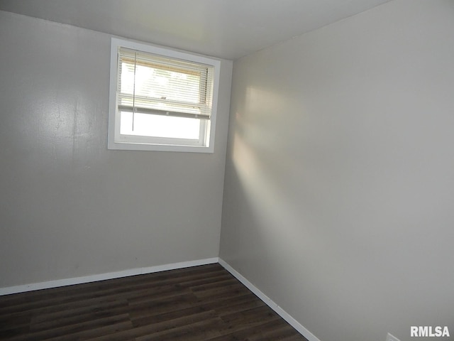 4125 Cresthill Dr, Davenport, IA 52806 - empty room featuring dark wood-type flooring and baseboards