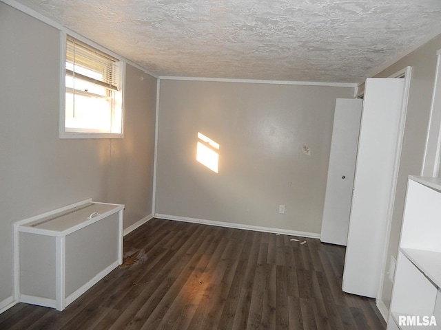 4125 Cresthill Dr, Davenport, IA 52806 - unfurnished room with wood finished floors, a textured ceiling, and ornamental molding