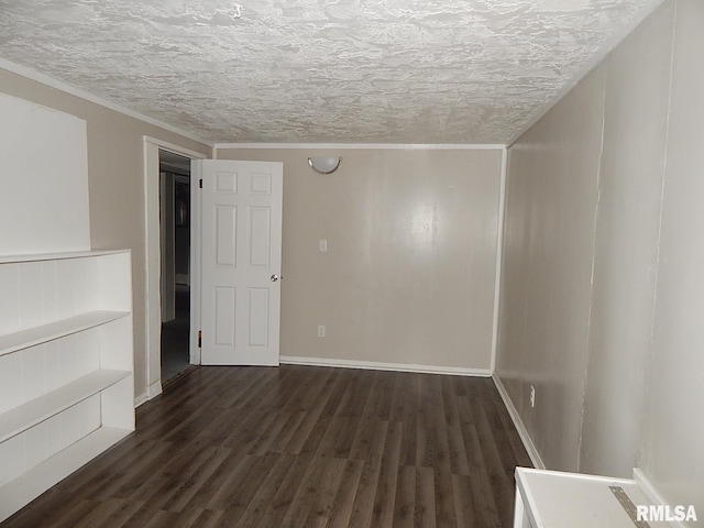 4125 Cresthill Dr, Davenport, IA 52806 - unfurnished room with a textured ceiling and dark wood-style floors