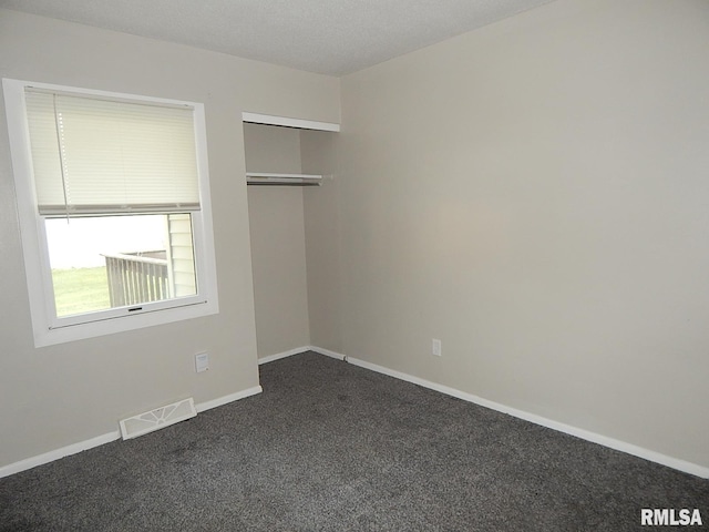 4125 Cresthill Dr, Davenport, IA 52806 - unfurnished room with dark carpet and baseboards