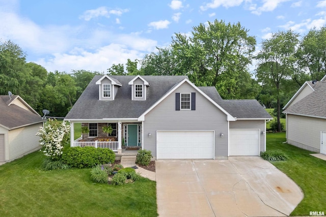 1100 Wild W Dr, Le Claire, IA 52753 - view of front of property featuring a porch, concrete driveway, a front yard, and a garage