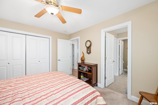 1100 Wild W Dr, Le Claire, IA 52753 - bedroom featuring a closet, light carpet, and ceiling fan