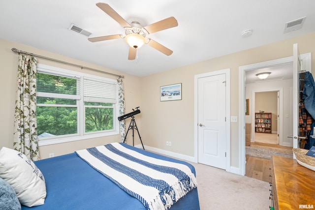 1100 Wild W Dr, Le Claire, IA 52753 - bedroom with a ceiling fan and carpet flooring
