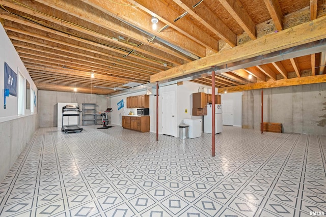 1100 Wild W Dr, Le Claire, IA 52753 - basement featuring freestanding refrigerator