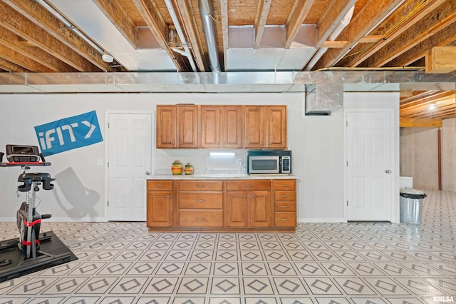 1100 Wild W Dr, Le Claire, IA 52753 - basement featuring baseboards and light floors