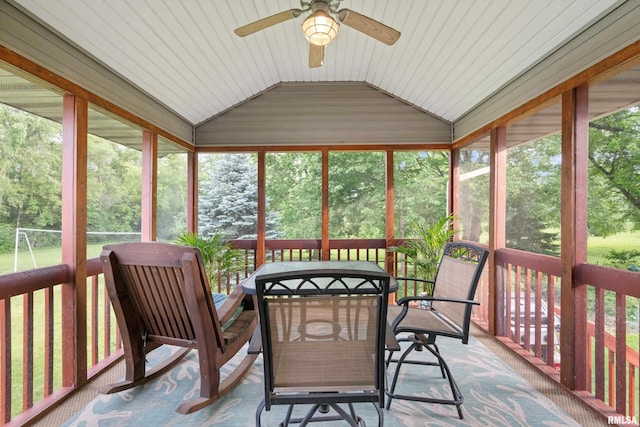 1100 Wild W Dr, Le Claire, IA 52753 - sunroom featuring a ceiling fan, vaulted ceiling, outdoor dining space, and plenty of natural light
