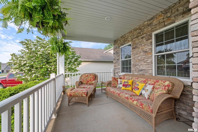 1100 Wild W Dr, Le Claire, IA 52753 - view of front of house with driveway, a front lawn, a porch, and a garage