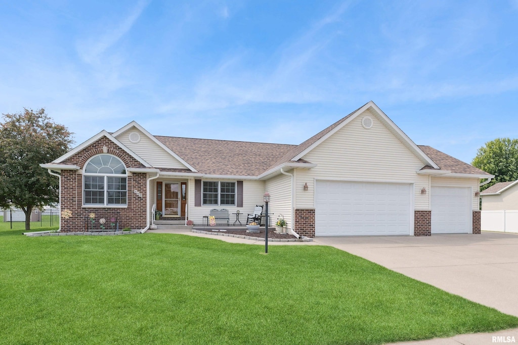 669 N 6th Street Cir, Princeton, IA 52768 - ranch-style house featuring a garage, driveway, brick siding, and a shingled roof