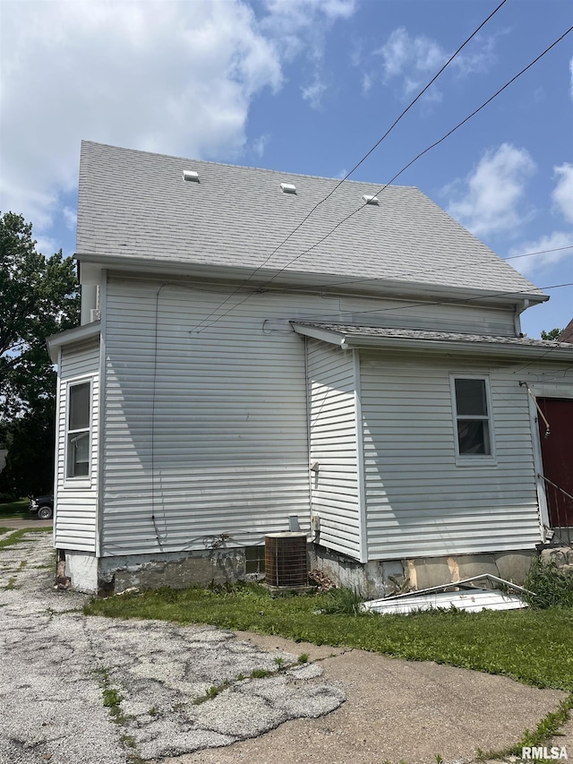 1109 S Michigan St, Davenport, IA 52802 - rear view of house with central AC unit and roof with shingles