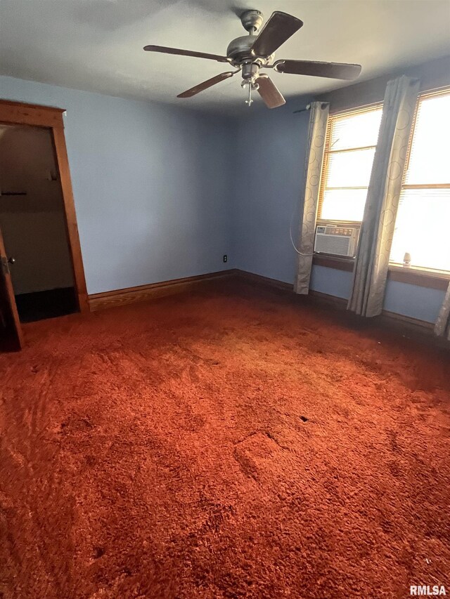 1109 S Michigan St, Davenport, IA 52802 - spare room featuring cooling unit, ceiling fan, carpet flooring, and baseboards