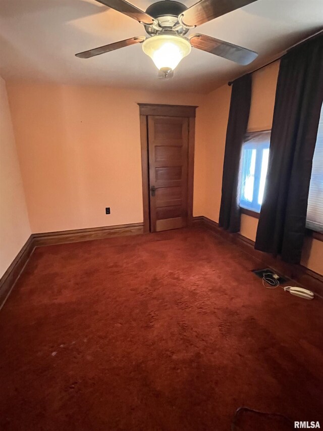 1109 S Michigan St, Davenport, IA 52802 - unfurnished room featuring a ceiling fan, carpet, and baseboards