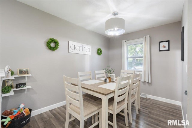 306 Myra Pl, Clinton, IA 52732 - dining room with baseboards and wood finished floors