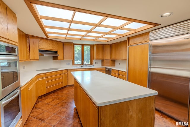 7 Sharon Ln, Fulton, IL 61252 - kitchen featuring stainless steel appliances, under cabinet range hood, a sink, light countertops, and tile patterned flooring