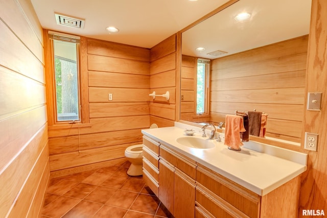 7 Sharon Ln, Fulton, IL 61252 - bathroom with vanity, toilet, wooden walls, tile patterned flooring, and recessed lighting