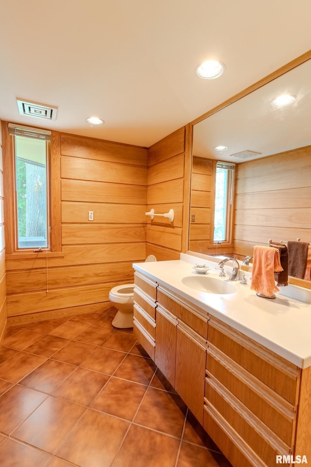 7 Sharon Ln, Fulton, IL 61252 - bathroom featuring vanity, toilet, wooden walls, tile patterned flooring, and recessed lighting