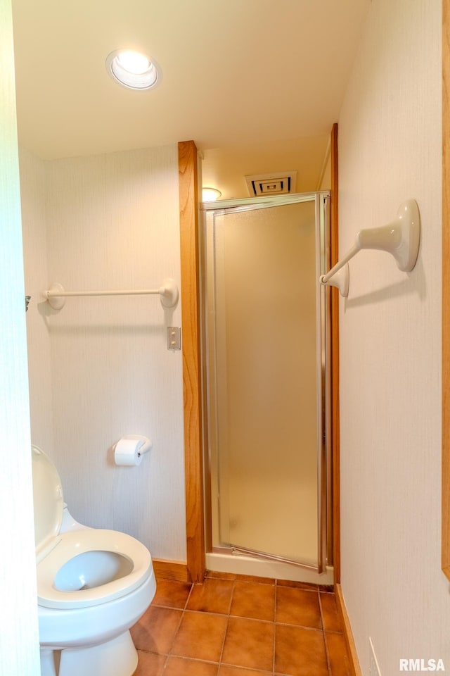7 Sharon Ln, Fulton, IL 61252 - bathroom with a shower stall, tile patterned flooring, toilet, and baseboards