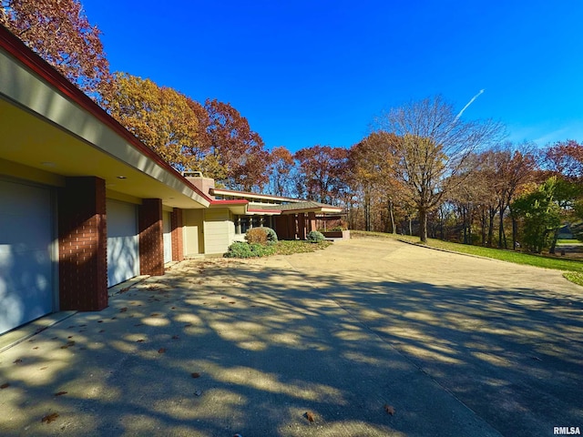 7 Sharon Ln, Fulton, IL 61252 - view of property exterior featuring driveway and brick siding