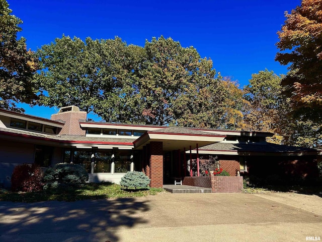 7 Sharon Ln, Fulton, IL 61252 - view of front of house with a chimney and roof with shingles