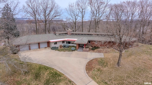 7 Sharon Ln, Fulton, IL 61252 - mid-century home featuring concrete driveway and a chimney