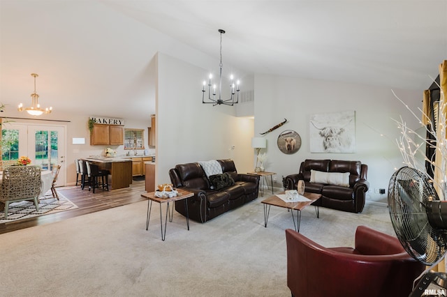 1710 Broeking Rd, Marion, IL 62959 - living room featuring a chandelier, vaulted ceiling, and light colored carpet