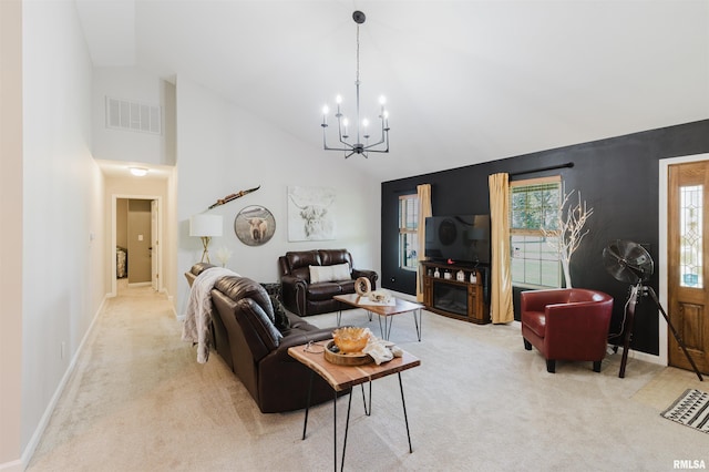 1710 Broeking Rd, Marion, IL 62959 - living area featuring light colored carpet, a chandelier, high vaulted ceiling, and baseboards