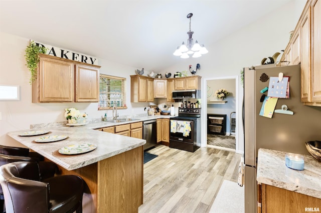 1710 Broeking Rd, Marion, IL 62959 - kitchen with appliances with stainless steel finishes, a sink, a peninsula, light countertops, and vaulted ceiling