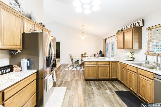 1710 Broeking Rd, Marion, IL 62959 - kitchen with a chandelier, a sink, a peninsula, lofted ceiling, and light wood-type flooring