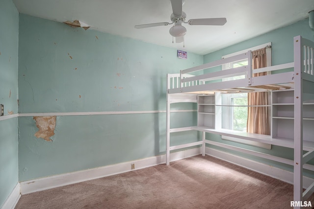 1032 Kirkwood Blvd, Davenport, IA 52803 - unfurnished bedroom with carpet and a ceiling fan