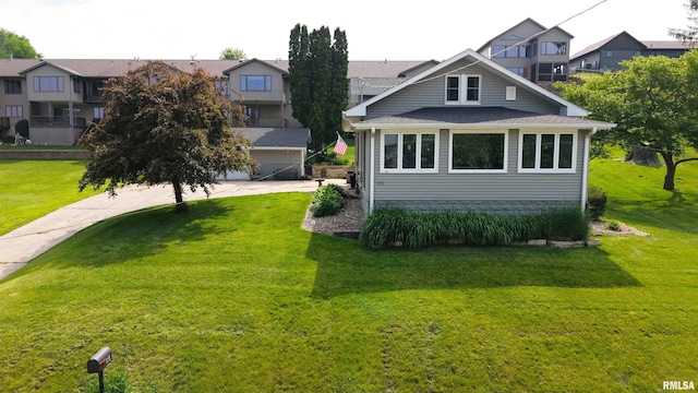 115 4th St, Fulton, IL 61252 - view of front of property featuring a front lawn, a residential view, and roof with shingles
