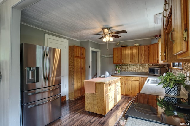 115 4th St, Fulton, IL 61252 - kitchen featuring stainless steel appliances, dark wood-type flooring, a ceiling fan, butcher block counters, and tasteful backsplash