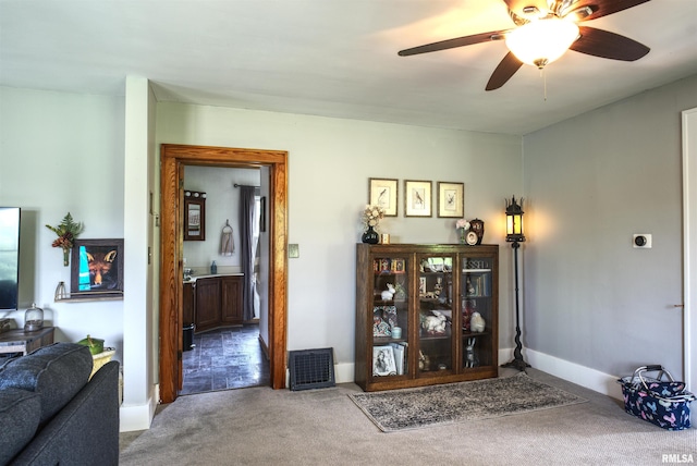 115 4th St, Fulton, IL 61252 - living area with carpet flooring and ceiling fan