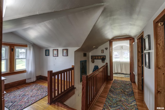 115 4th St, Fulton, IL 61252 - corridor with vaulted ceiling, wood finished floors, and an upstairs landing