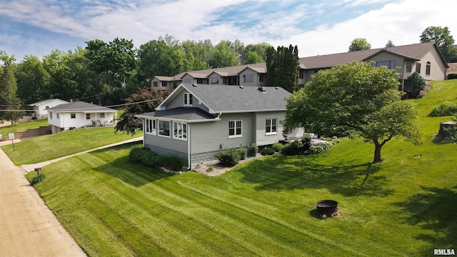 115 4th St, Fulton, IL 61252 - view of front facade with a front yard and roof with shingles
