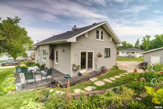 115 4th St, Fulton, IL 61252 - back of house featuring a chimney, a wooden deck, and a shingled roof