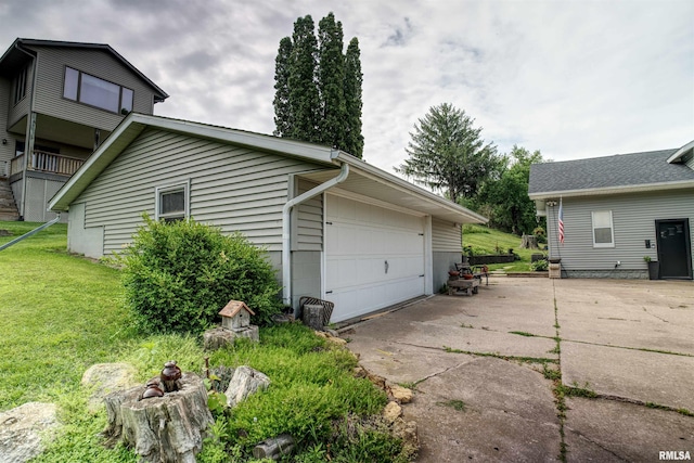 115 4th St, Fulton, IL 61252 - view of property exterior with a garage and a yard