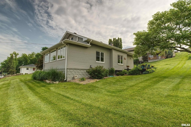 115 4th St, Fulton, IL 61252 - view of side of property featuring a lawn