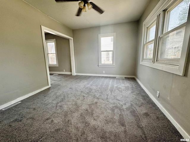 1150 14th Ave, Moline, IL 61265 - spare room with carpet floors and a ceiling fan