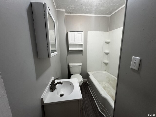 1150 14th Ave, Moline, IL 61265 - full bath with a textured ceiling, vanity, wood finished floors, and shower / bath combination