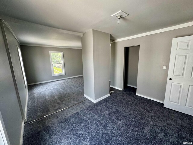 1150 14th Ave, Moline, IL 61265 - empty room with dark colored carpet and ornamental molding