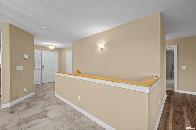 6365 Friendship Path, Bettendorf, IA 52722 - hallway featuring baseboards and a textured ceiling