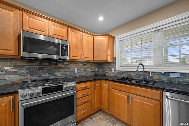 6365 Friendship Path, Bettendorf, IA 52722 - kitchen featuring stainless steel appliances, backsplash, dark stone counters, brown cabinets, and recessed lighting