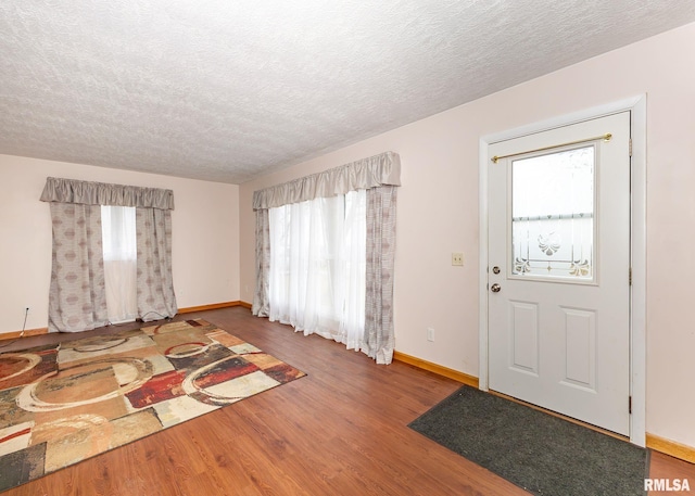 2678 170th Ave, Sherrard, IL 61281 - foyer featuring a textured ceiling, healthy amount of natural light, and wood finished floors