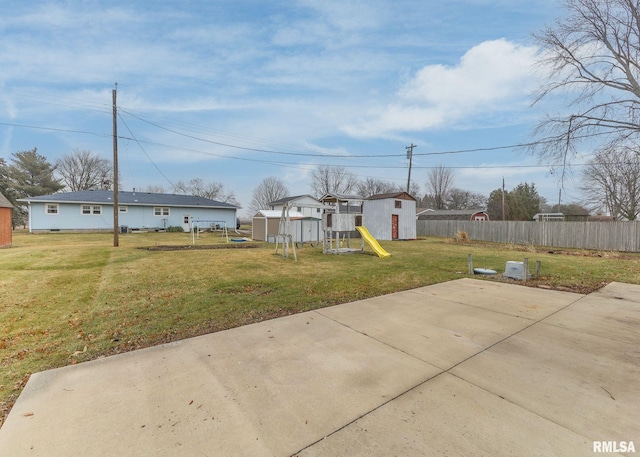 2678 170th Ave, Sherrard, IL 61281 - view of yard featuring a storage shed, a playground, and a patio area