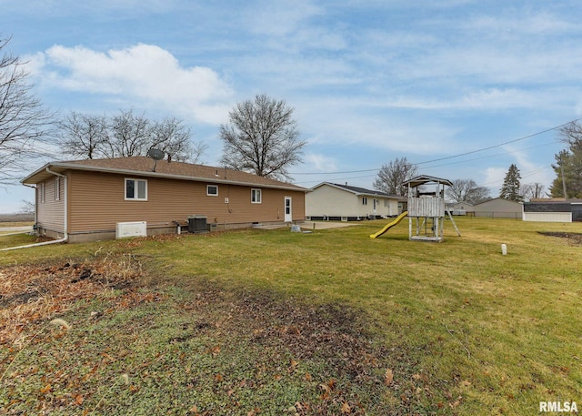 2678 170th Ave, Sherrard, IL 61281 - back of house featuring a playground and a yard