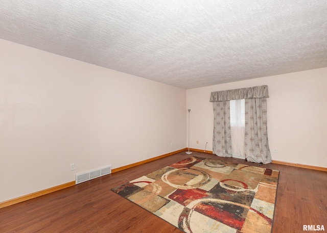 2678 170th Ave, Sherrard, IL 61281 - unfurnished room with wood finished floors and a textured ceiling