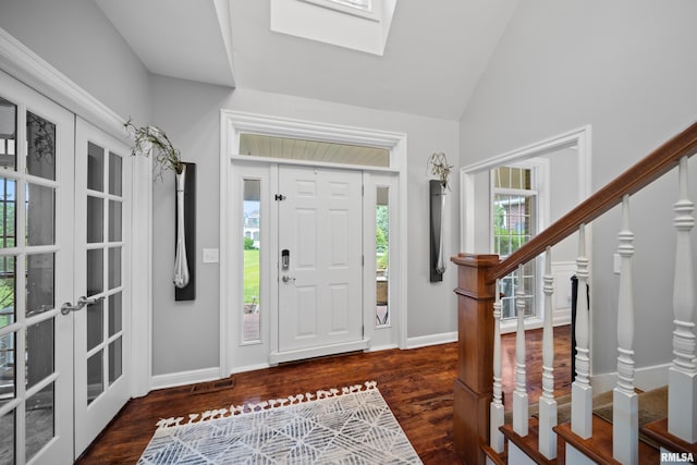 5 High Point Pl, Bettendorf, IA 52722 - entrance foyer featuring stairs, wood finished floors, vaulted ceiling, a skylight, and french doors