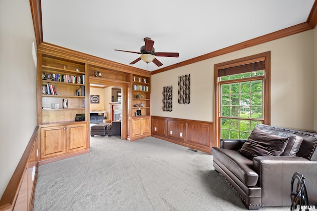 5 High Point Pl, Bettendorf, IA 52722 - office area with crown molding, a ceiling fan, built in features, a wainscoted wall, and light colored carpet